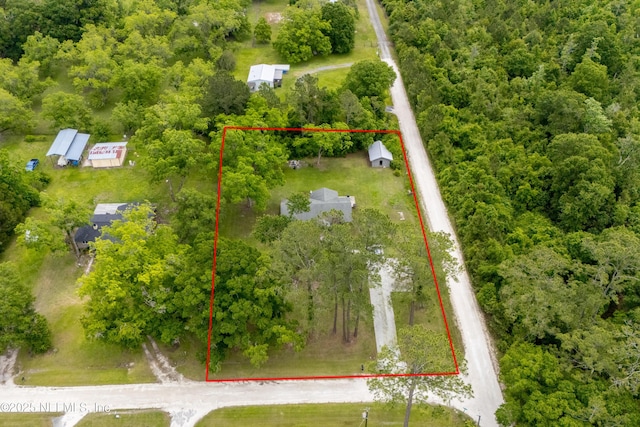 view of property location featuring property boundaries highlighted and a forest