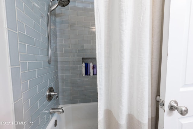 bathroom with shower / bath combo with shower curtain