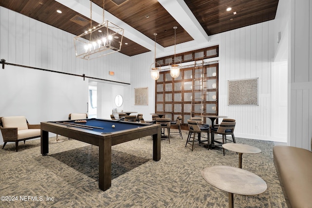 recreation room with wood ceiling, billiards, a towering ceiling, a chandelier, and carpet flooring