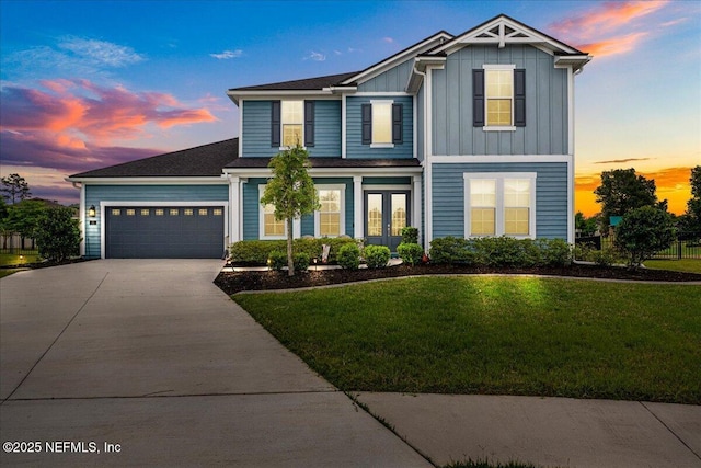 71 Lansing Ct, Saint Augustine, FL 32092 - traditional home with concrete driveway, a lawn, french doors, a garage, and board and batten siding