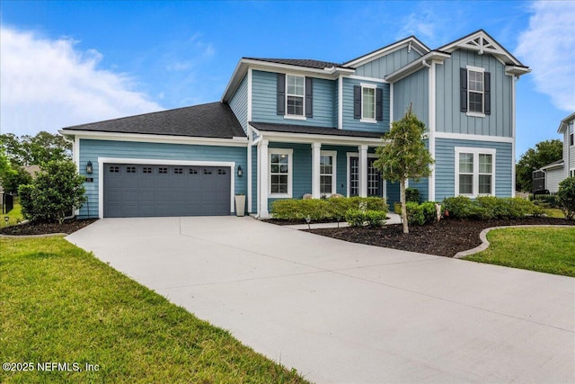71 Lansing Ct, Saint Augustine, FL 32092 - traditional home featuring a garage, board and batten siding, driveway, and a front lawn