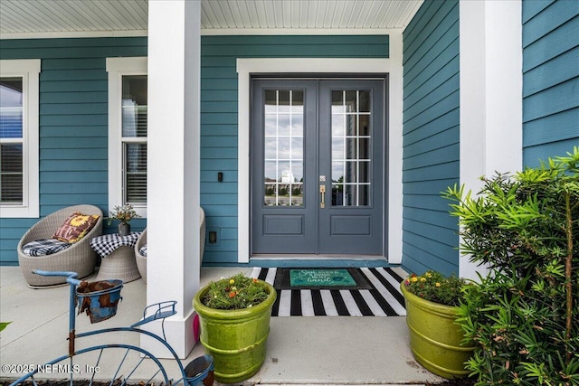 71 Lansing Ct, Saint Augustine, FL 32092 - doorway to property with covered porch and french doors