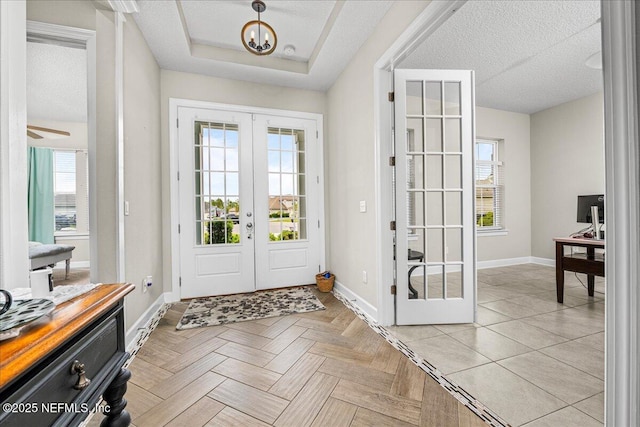 71 Lansing Ct, Saint Augustine, FL 32092 - foyer featuring french doors, plenty of natural light, baseboards, and a textured ceiling