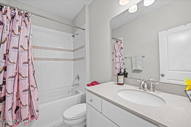 71 Lansing Ct, Saint Augustine, FL 32092 - full bathroom featuring toilet, shower / bathtub combination with curtain, vanity, and a textured ceiling