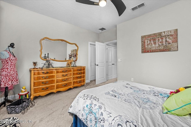 71 Lansing Ct, Saint Augustine, FL 32092 - carpeted bedroom with a textured ceiling and a ceiling fan