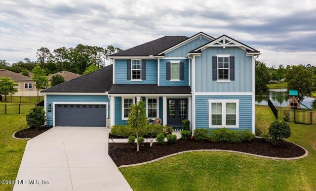 71 Lansing Ct, Saint Augustine, FL 32092 - view of front of property with board and batten siding, an attached garage, concrete driveway, french doors, and a porch