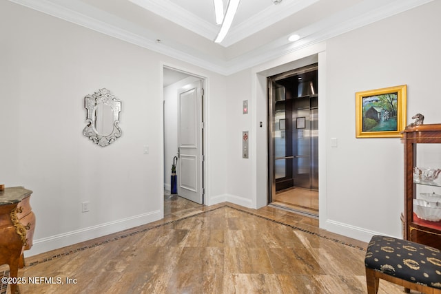 corridor featuring baseboards, marble tiled flooring, elevator, ornamental molding, and inlaid floor details