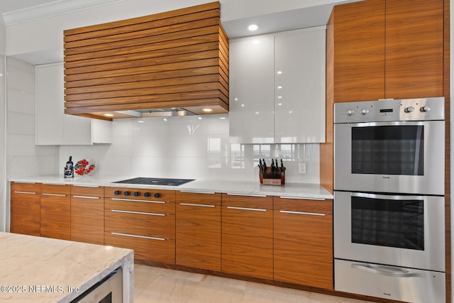 kitchen featuring double oven, a warming drawer, extractor fan, modern cabinets, and black cooktop