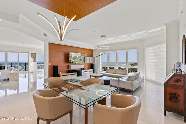 dining space featuring crown molding, light tile patterned flooring, and a chandelier