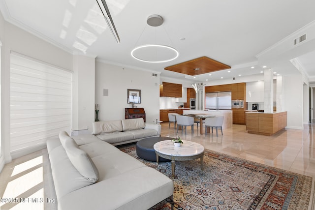 living area with ornamental molding, recessed lighting, and a raised ceiling