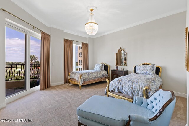carpeted bedroom featuring access to exterior, crown molding, baseboards, and a chandelier