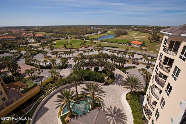 aerial view of a golf course and a nearby body of water