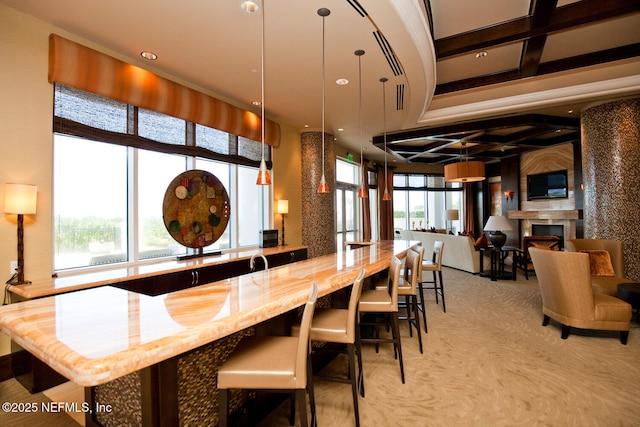 bar area featuring light colored carpet, coffered ceiling, recessed lighting, beamed ceiling, and a fireplace