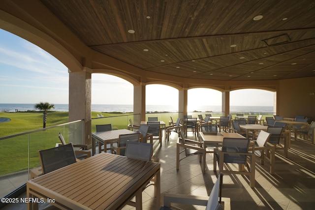 view of patio / terrace featuring outdoor dining space and a water view