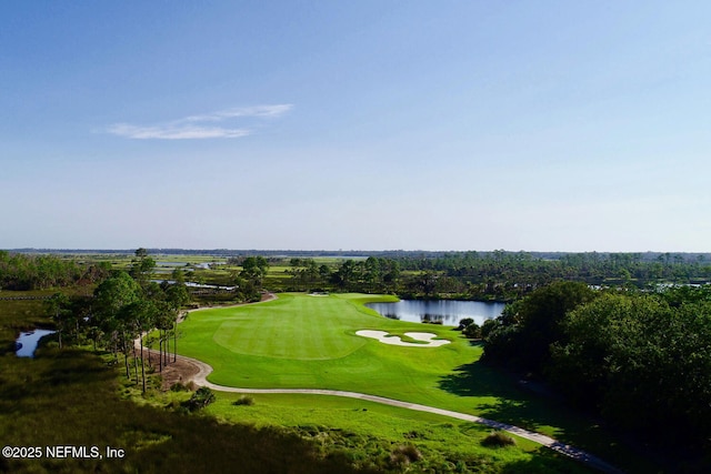 bird's eye view of a nearby body of water and a local golf course