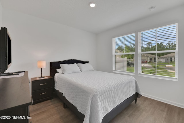 2304 Shady Breeze Ln, Green Cove Springs, FL 32043 - bedroom featuring wood finished floors and baseboards
