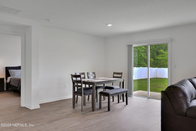 2304 Shady Breeze Ln, Green Cove Springs, FL 32043 - dining room with light wood finished floors, recessed lighting, and baseboards