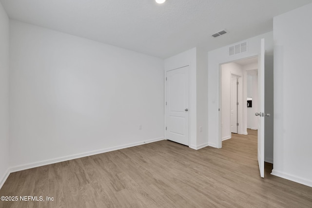 2304 Shady Breeze Ln, Green Cove Springs, FL 32043 - unfurnished bedroom featuring wood finished floors and baseboards