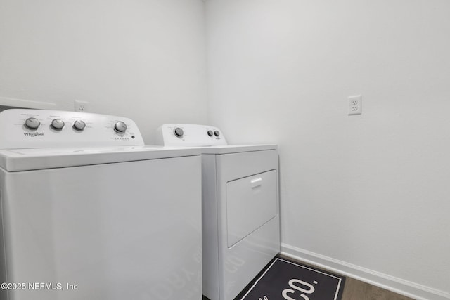 2304 Shady Breeze Ln, Green Cove Springs, FL 32043 - laundry area with washer and dryer, baseboards, and wood finished floors