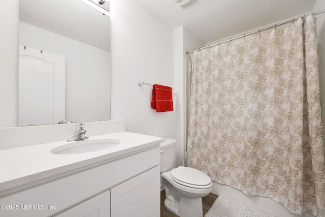 2304 Shady Breeze Ln, Green Cove Springs, FL 32043 - bathroom featuring toilet, vanity, and a textured ceiling