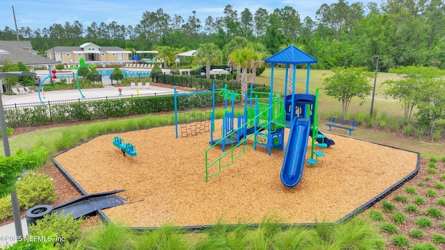 2304 Shady Breeze Ln, Green Cove Springs, FL 32043 - community jungle gym featuring fence and view of scattered trees