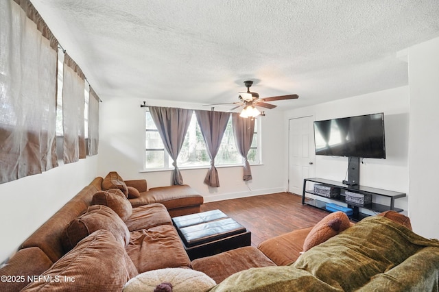 5388 Woodcrest Rd, Jacksonville, FL 32205 - living area with wood finished floors, a textured ceiling, ceiling fan, and baseboards