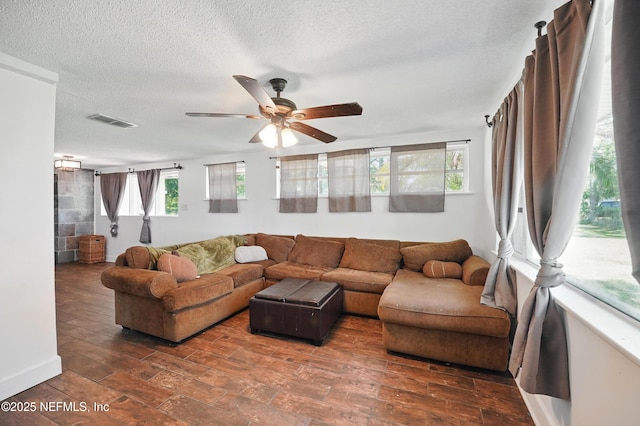 5388 Woodcrest Rd, Jacksonville, FL 32205 - living room with a ceiling fan, wood finished floors, and a textured ceiling