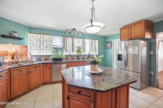 5388 Woodcrest Rd, Jacksonville, FL 32205 - kitchen featuring appliances with stainless steel finishes, a sink, brown cabinets, open shelves, and tasteful backsplash