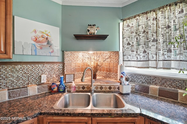 5388 Woodcrest Rd, Jacksonville, FL 32205 - kitchen featuring a sink, tasteful backsplash, crown molding, dark countertops, and brown cabinets