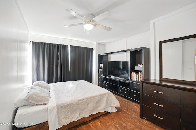 5388 Woodcrest Rd, Jacksonville, FL 32205 - bedroom featuring dark wood-style flooring, ceiling fan, and ornamental molding