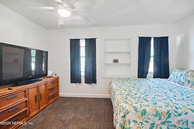 5388 Woodcrest Rd, Jacksonville, FL 32205 - bedroom with dark colored carpet, baseboards, and a ceiling fan