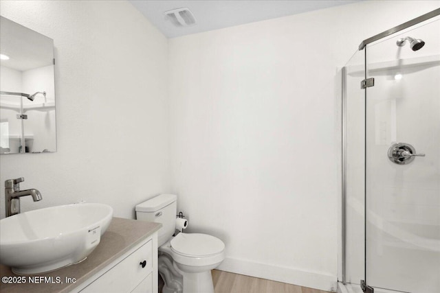 2777 S Ponte Vedra Blvd, Ponte Vedra Beach, FL 32082 - bathroom featuring a shower stall, wood finished floors, vanity, and toilet