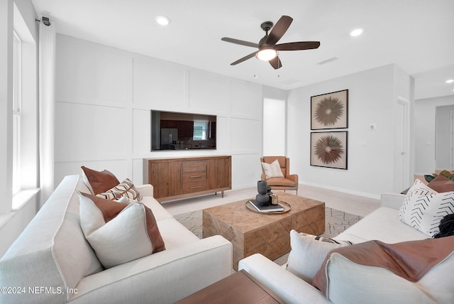living area with recessed lighting, ceiling fan, and baseboards