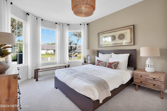 bedroom with light colored carpet