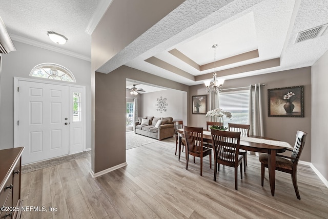 116 Greenfield Dr, Saint Johns, FL 32259 - dining space with a textured ceiling, light wood-style floors, baseboards, a ceiling fan, and crown molding