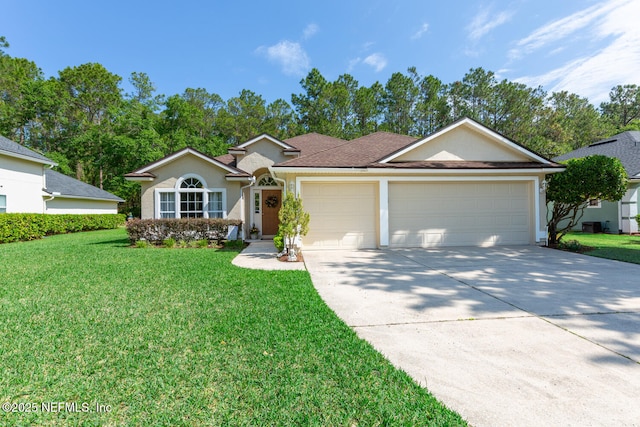 116 Greenfield Dr, Saint Johns, FL 32259 - ranch-style home featuring an attached garage, concrete driveway, a front lawn, and stucco siding