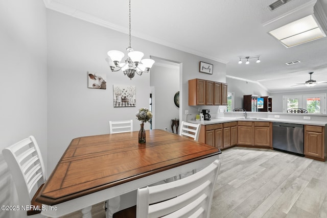 116 Greenfield Dr, Saint Johns, FL 32259 - dining space with ornamental molding, a chandelier, light wood-style floors, and ceiling fan