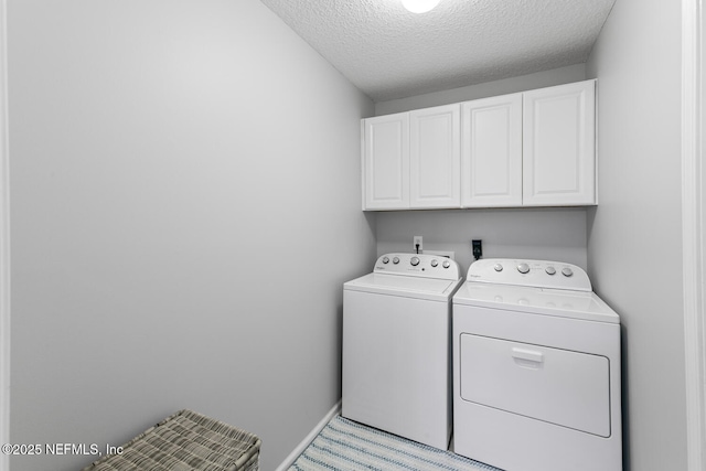 116 Greenfield Dr, Saint Johns, FL 32259 - laundry area featuring cabinet space, washer and dryer, and a textured ceiling