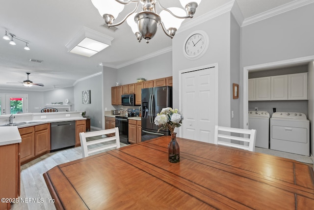 116 Greenfield Dr, Saint Johns, FL 32259 - dining room with independent washer and dryer, a chandelier, crown molding, light wood-style flooring, and a ceiling fan