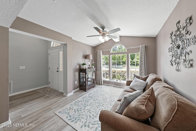 116 Greenfield Dr, Saint Johns, FL 32259 - living room with light wood-style flooring, ceiling fan, lofted ceiling, a textured ceiling, and baseboards