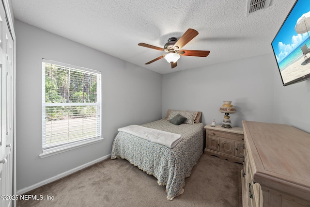 116 Greenfield Dr, Saint Johns, FL 32259 - bedroom featuring light carpet, baseboards, a textured ceiling, and ceiling fan