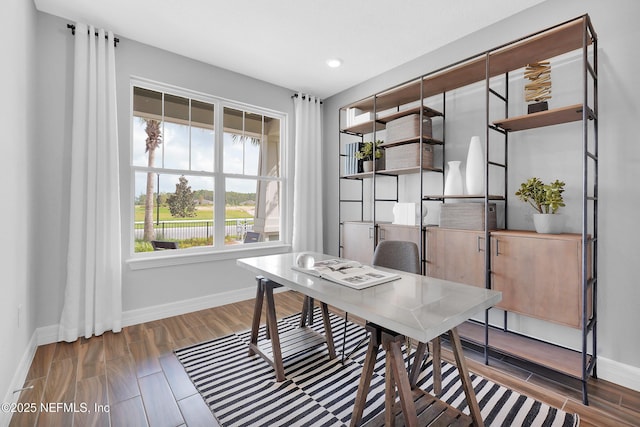 office space featuring baseboards, recessed lighting, and wood finish floors