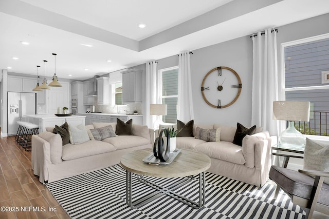 living room featuring wood finished floors and recessed lighting