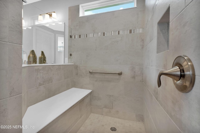 full bathroom with a tile shower