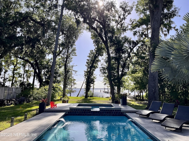 182 N Ridge Dr, Fleming Island, FL 32003 - view of pool with a patio area, a pool with connected hot tub, and a water view