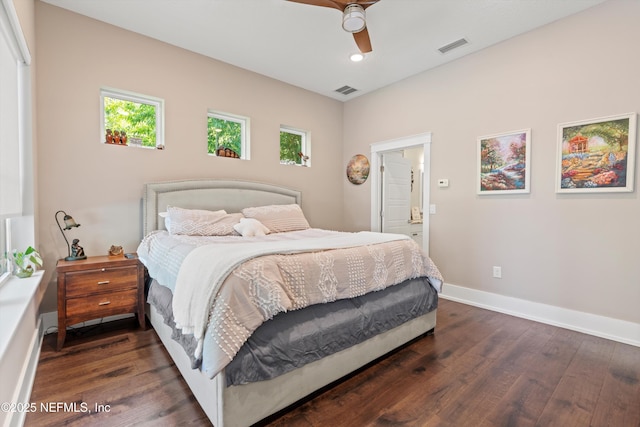 182 N Ridge Dr, Fleming Island, FL 32003 - bedroom featuring dark wood-style floors, multiple windows, and baseboards