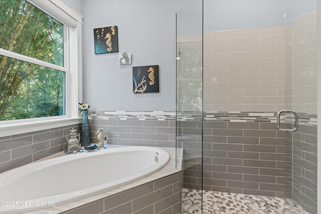 182 N Ridge Dr, Fleming Island, FL 32003 - bathroom featuring a shower stall and a garden tub