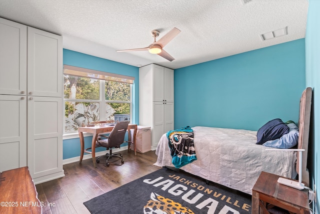 182 N Ridge Dr, Fleming Island, FL 32003 - bedroom featuring dark wood-style flooring, a textured ceiling, ceiling fan, and an office area