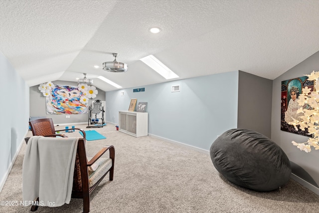 182 N Ridge Dr, Fleming Island, FL 32003 - cinema room featuring vaulted ceiling, a skylight, a textured ceiling, carpet flooring, and baseboards