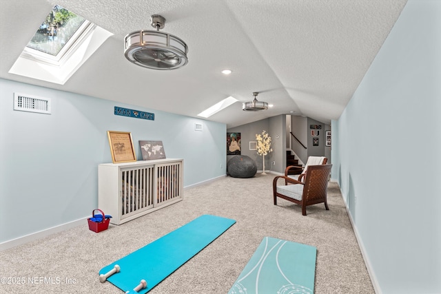 182 N Ridge Dr, Fleming Island, FL 32003 - rec room featuring a skylight, carpet flooring, lofted ceiling, a textured ceiling, and baseboards